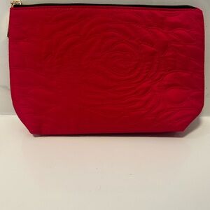 Elegant Red Quilted Clutch looks Red/Pink it’s New no tags. Stunning makeup bag